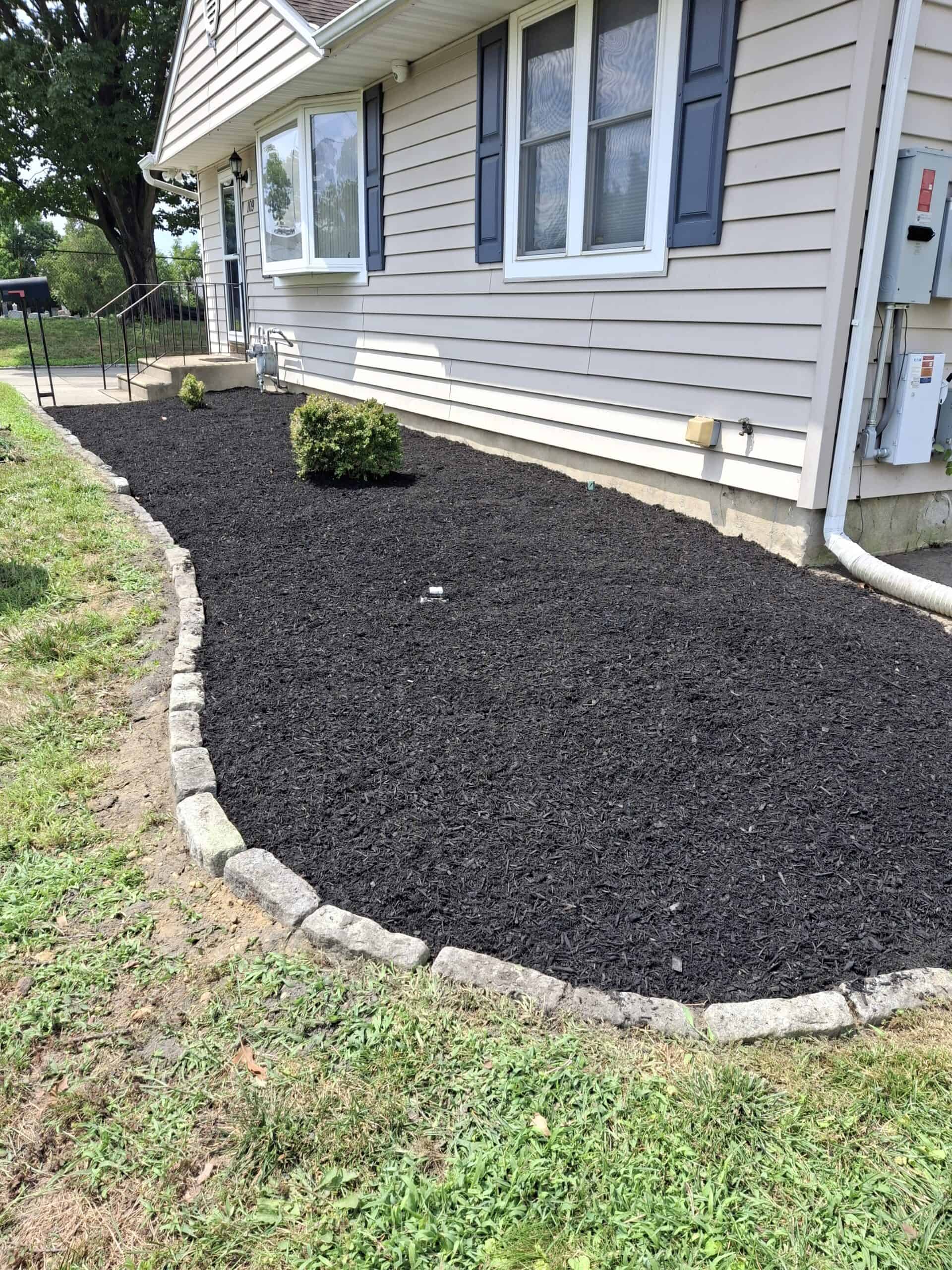 Landscaping and lawn service for home exterior enhancement.